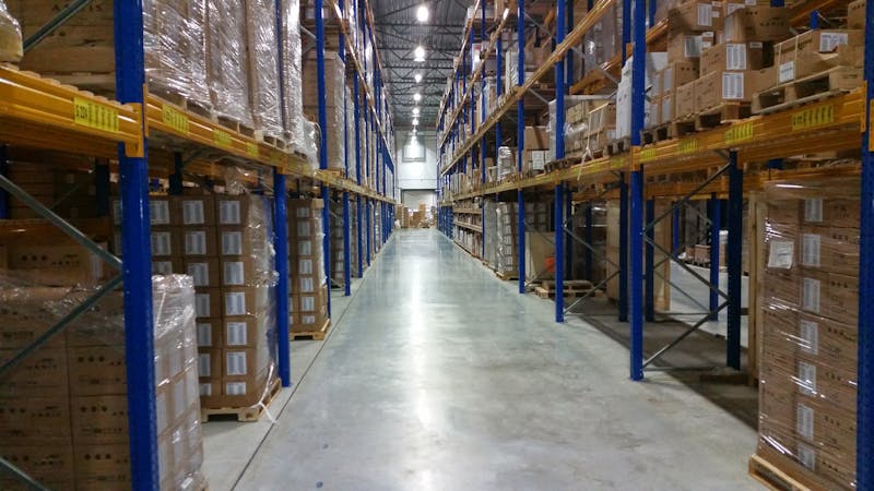 Business inventory boxes stored on shelves in a self storage unit